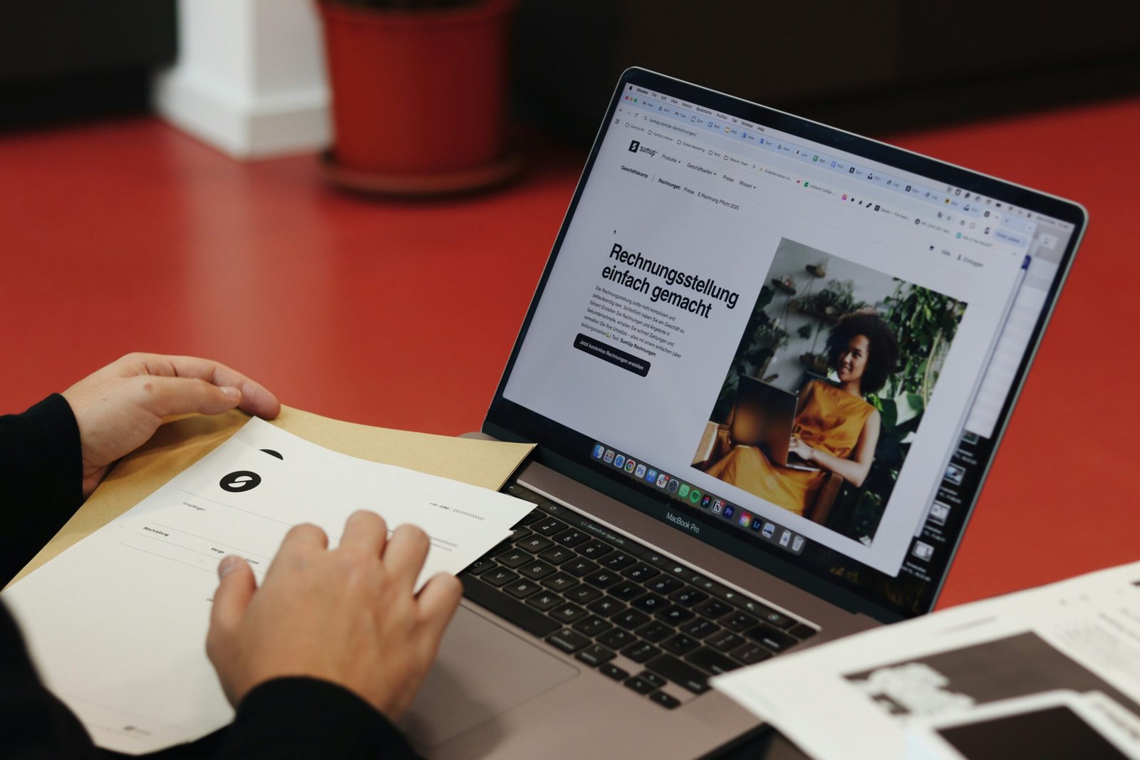 A person sitting at a table with a laptop